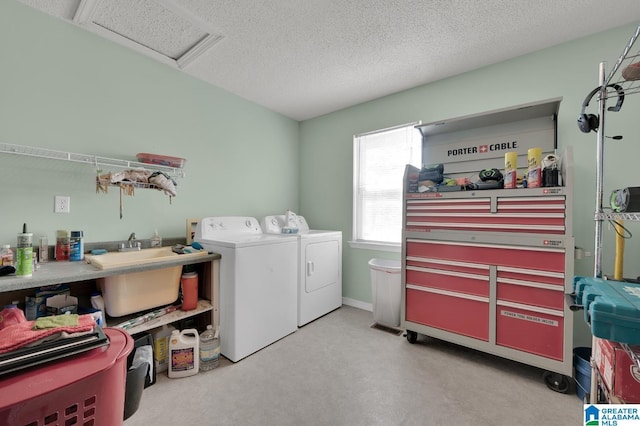 135 Hayden Springs Rd, Hayden, AL 35079 - clothes washing area featuring laundry area, attic access, a sink, a textured ceiling, and washer and clothes dryer