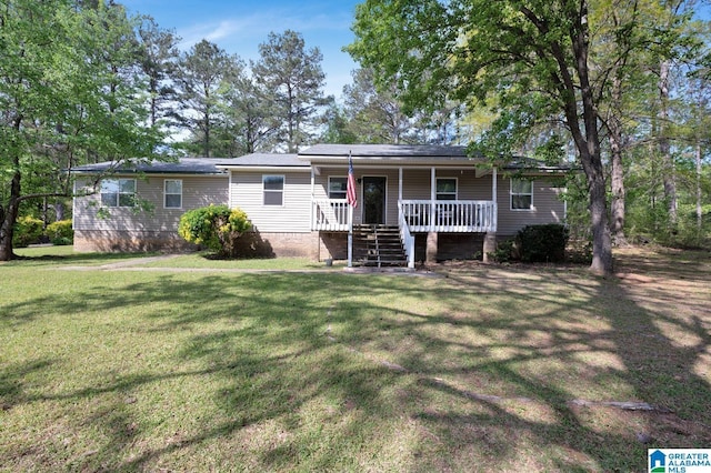 135 Hayden Springs Rd, Hayden, AL 35079 - ranch-style house with a front yard and a porch