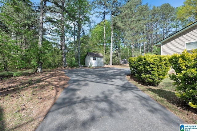135 Hayden Springs Rd, Hayden, AL 35079 - exterior space featuring driveway, a storage shed, and an outbuilding
