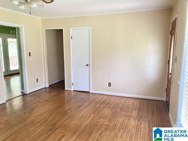 4905 Spunky Hollow Rd, Remlap, AL 35133 - empty room featuring ornamental molding, a ceiling fan, wood finished floors, and baseboards