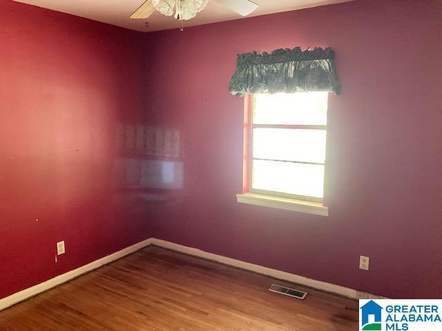 4905 Spunky Hollow Rd, Remlap, AL 35133 - empty room featuring a wealth of natural light, visible vents, and wood finished floors