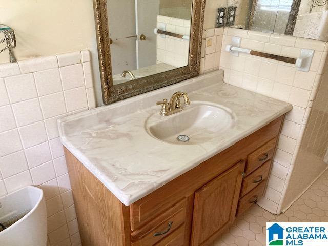 4905 Spunky Hollow Rd, Remlap, AL 35133 - bathroom featuring tile walls and vanity