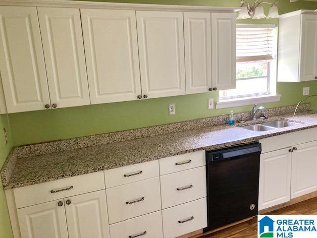 4905 Spunky Hollow Rd, Remlap, AL 35133 - kitchen with light stone countertops, dishwasher, white cabinets, and a sink