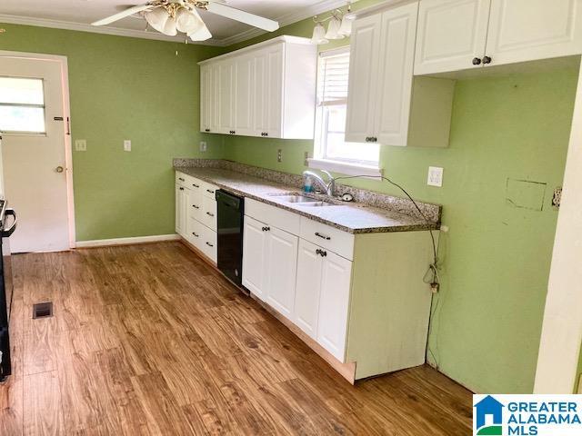 4905 Spunky Hollow Rd, Remlap, AL 35133 - kitchen featuring a sink, black dishwasher, ceiling fan, crown molding, and white cabinetry