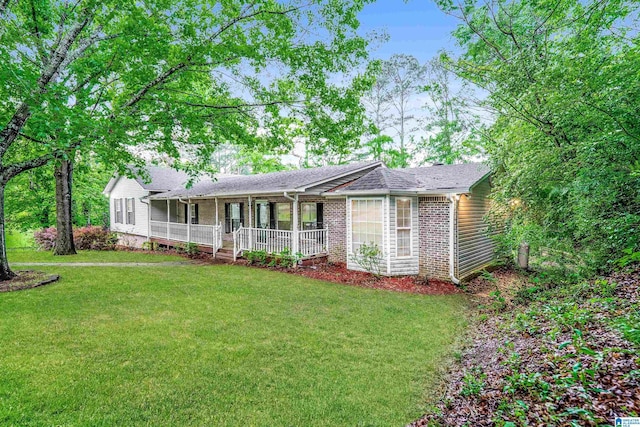3004 Happy Top Rd, Morris, AL 35116 - view of front facade with brick siding, a front lawn, and covered porch