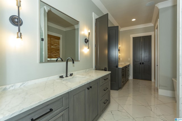 bathroom featuring two vanities, a sink, baseboards, marble finish floor, and recessed lighting