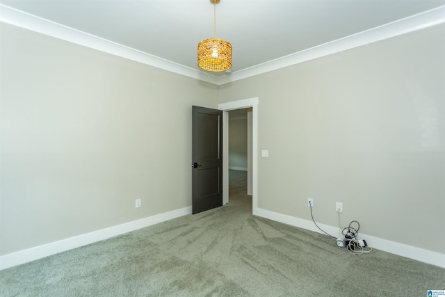 carpeted empty room featuring baseboards