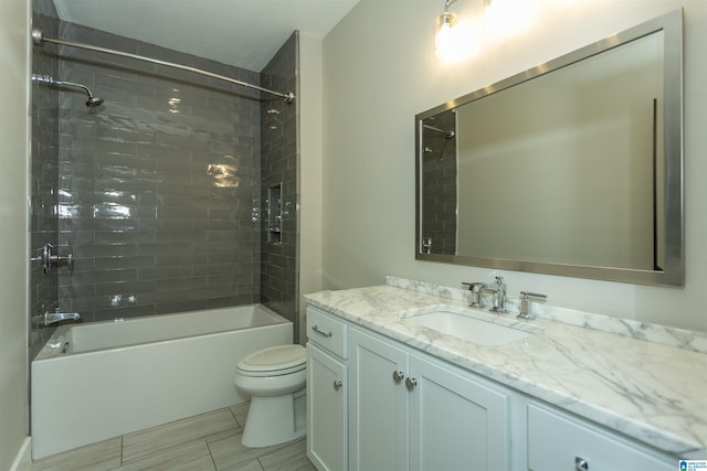 bathroom with vanity, toilet, and bathtub / shower combination