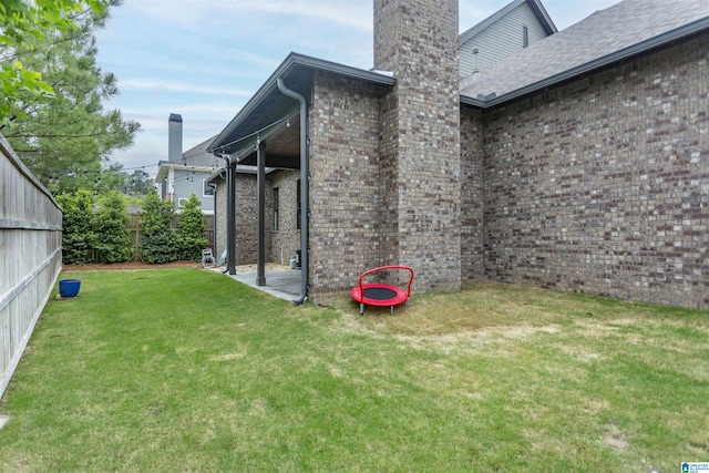 exterior space featuring fence and a patio