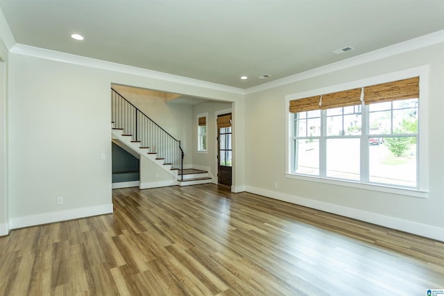 unfurnished living room with stairs, recessed lighting, visible vents, and wood finished floors