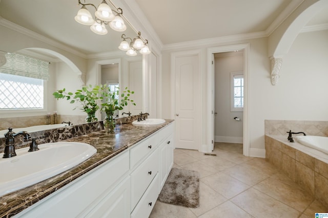 bathroom with plenty of natural light, a sink, and a bath