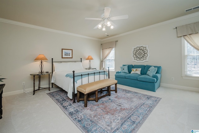 bedroom with baseboards, ornamental molding, light colored carpet, and visible vents