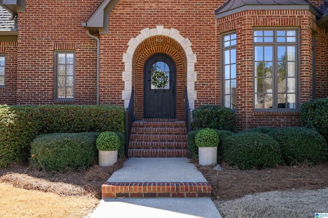 entrance to property with brick siding