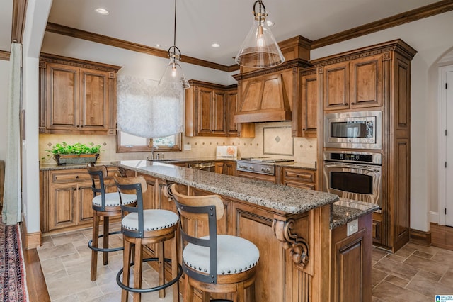 kitchen featuring a sink, a center island, brown cabinetry, and stainless steel appliances