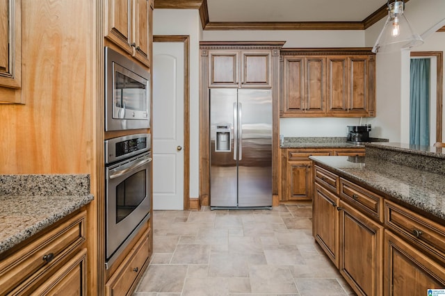 kitchen with stone countertops, crown molding, stone finish floor, and stainless steel appliances