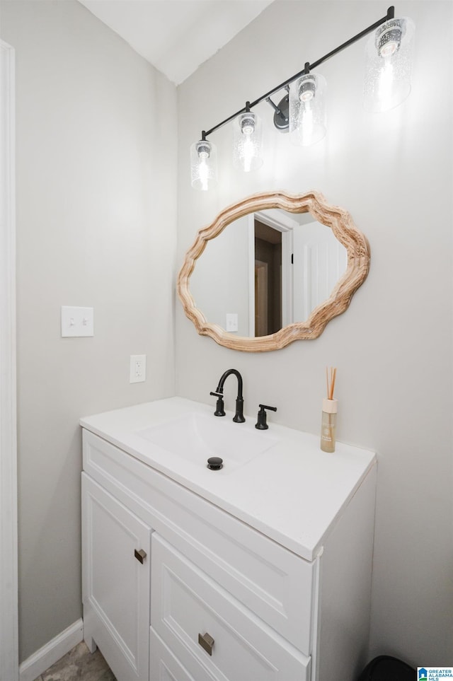 bathroom with vanity and baseboards