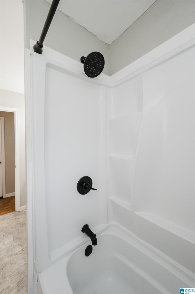 room details featuring shower / bathing tub combination