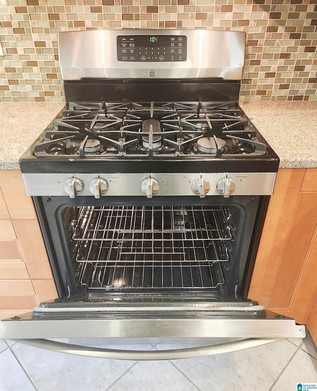 574 Turtle Creek Dr, Hoover, AL 35226 - kitchen view of stainless steel gas range and decorative backsplash