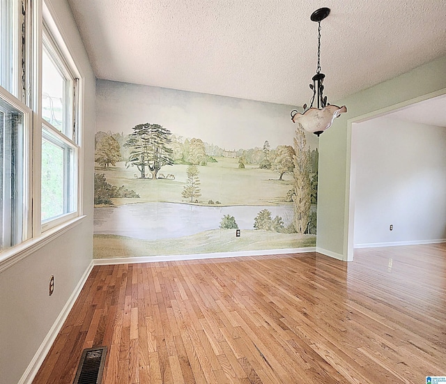 574 Turtle Creek Dr, Hoover, AL 35226 - unfurnished dining area with hardwood / wood-style floors, a textured ceiling, baseboards, and a chandelier