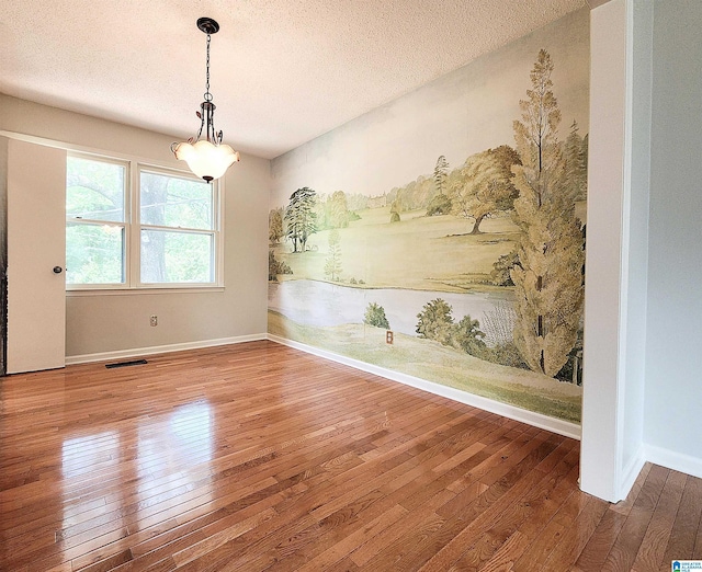 574 Turtle Creek Dr, Hoover, AL 35226 - spare room with wood-type flooring, a textured ceiling, and baseboards