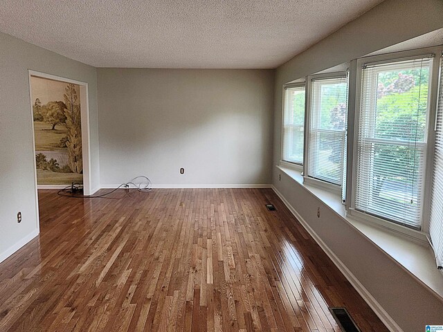 574 Turtle Creek Dr, Hoover, AL 35226 - unfurnished room featuring wood-type flooring, a textured ceiling, and baseboards