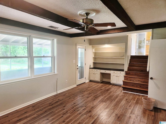 574 Turtle Creek Dr, Hoover, AL 35226 - unfurnished living room with dark wood-type flooring, baseboards, a ceiling fan, beam ceiling, and a textured ceiling