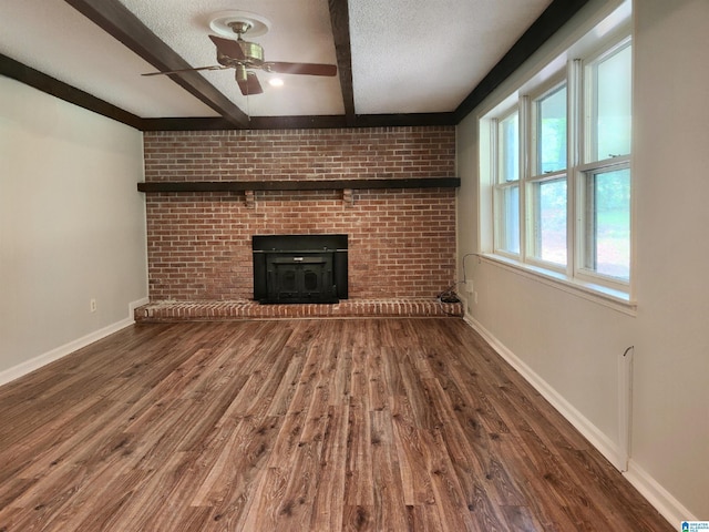 574 Turtle Creek Dr, Hoover, AL 35226 - unfurnished living room with beamed ceiling, a ceiling fan, wood finished floors, baseboards, and a textured ceiling