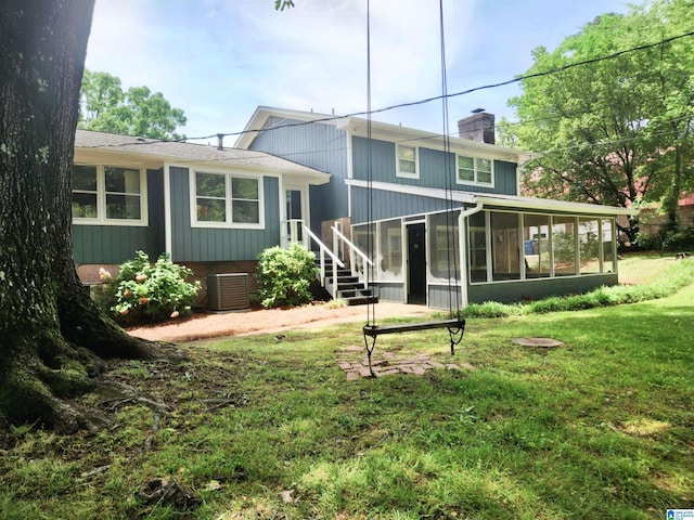 574 Turtle Creek Dr, Hoover, AL 35226 - rear view of property with a sunroom, a chimney, a lawn, central air condition unit, and stairway