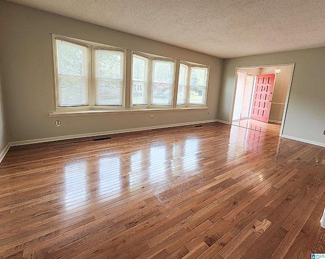 574 Turtle Creek Dr, Hoover, AL 35226 - spare room featuring wood-type flooring, a textured ceiling, and baseboards