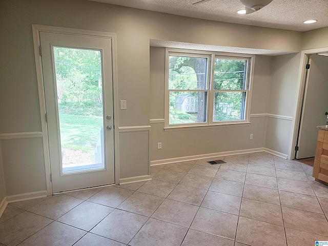 574 Turtle Creek Dr, Hoover, AL 35226 - doorway to outside featuring light tile patterned flooring, a textured ceiling, and baseboards