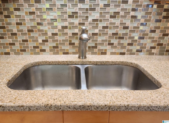 574 Turtle Creek Dr, Hoover, AL 35226 - kitchen view of a sink, tasteful backsplash, and light stone countertops