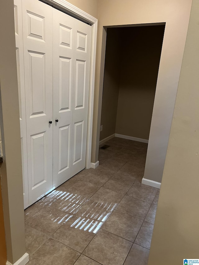 2128 Rockland Dr, Hoover, AL 35226 - hallway with tile patterned flooring and baseboards