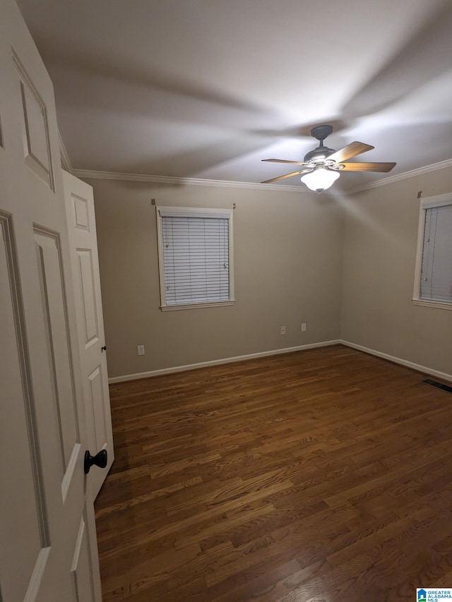 2128 Rockland Dr, Hoover, AL 35226 - empty room featuring crown molding, a ceiling fan, dark wood-style flooring, and baseboards