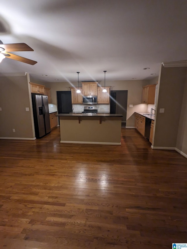 2128 Rockland Dr, Hoover, AL 35226 - kitchen featuring appliances with stainless steel finishes, ceiling fan, dark wood-type flooring, baseboards, and a kitchen bar