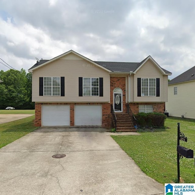 5274 Flint Hill Trce, Bessemer, AL 35022 - bi-level home featuring driveway, a front yard, brick siding, and a garage