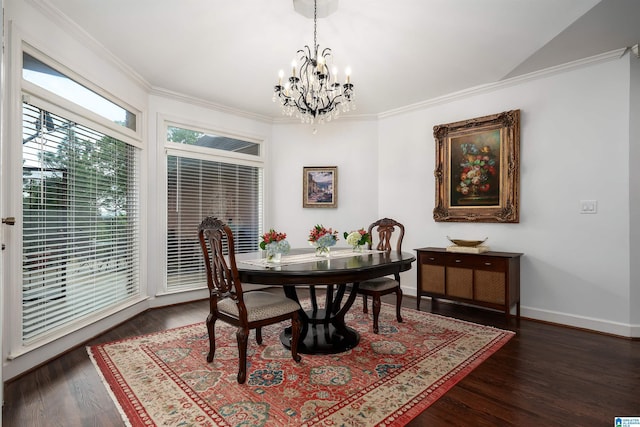 dining room featuring an inviting chandelier, ornamental molding, baseboards, and wood finished floors