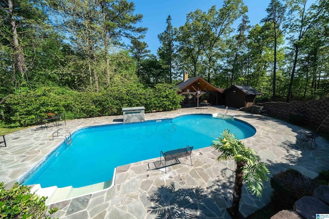 outdoor pool with a patio area