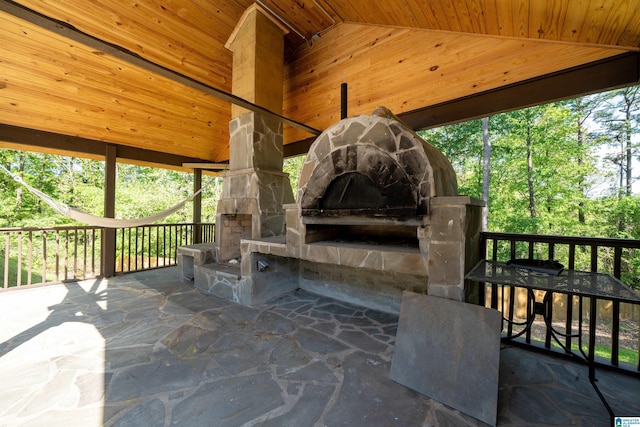 view of patio featuring an outdoor fireplace