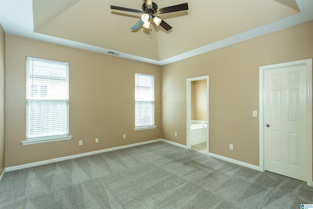 1127 Avalon Dr, Moody, AL 35004 - carpeted empty room featuring baseboards, visible vents, a ceiling fan, and a tray ceiling
