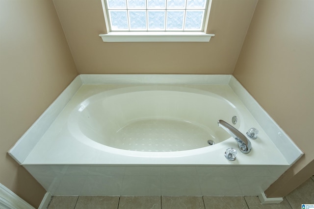1127 Avalon Dr, Moody, AL 35004 - full bathroom featuring a garden tub and tile patterned flooring