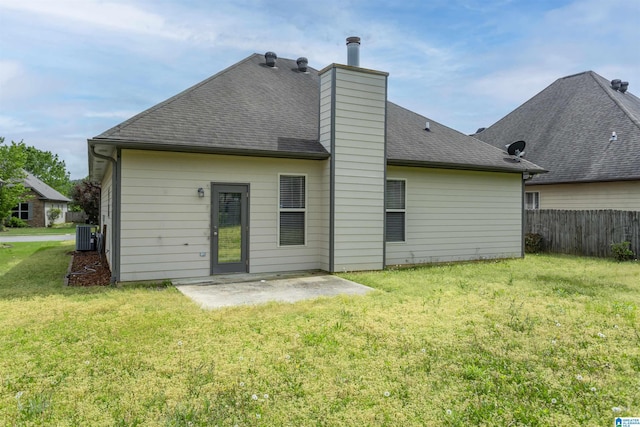 1127 Avalon Dr, Moody, AL 35004 - back of house featuring a lawn, fence, roof with shingles, and a patio area