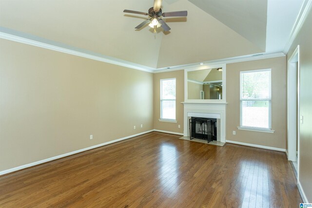 1127 Avalon Dr, Moody, AL 35004 - unfurnished living room featuring a ceiling fan, a fireplace with flush hearth, a wealth of natural light, and wood finished floors