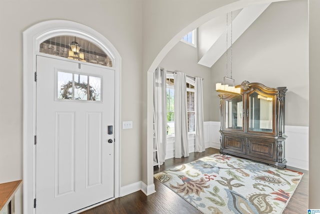 1104 Norman Way, Birmingham, AL 35242 - foyer entrance featuring arched walkways, wainscoting, a towering ceiling, and wood finished floors