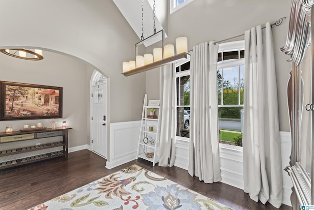 1104 Norman Way, Birmingham, AL 35242 - foyer entrance featuring dark wood-type flooring, arched walkways, a high ceiling, and a wainscoted wall