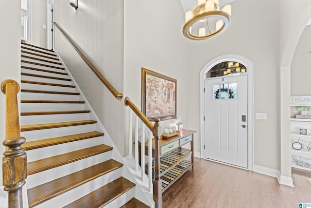 1104 Norman Way, Birmingham, AL 35242 - entrance foyer with stairs, wood finished floors, baseboards, a chandelier, and arched walkways