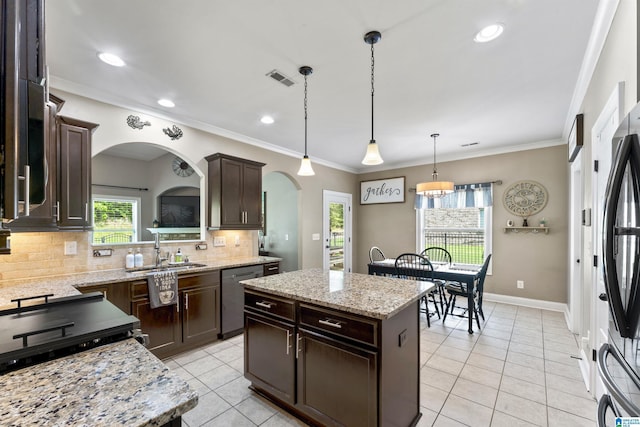 1104 Norman Way, Birmingham, AL 35242 - kitchen with a sink, light tile patterned floors, dark brown cabinetry, and stainless steel appliances