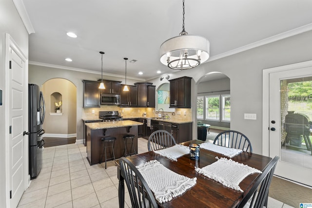 1104 Norman Way, Birmingham, AL 35242 - dining room featuring arched walkways, light tile patterned floors, and a healthy amount of sunlight