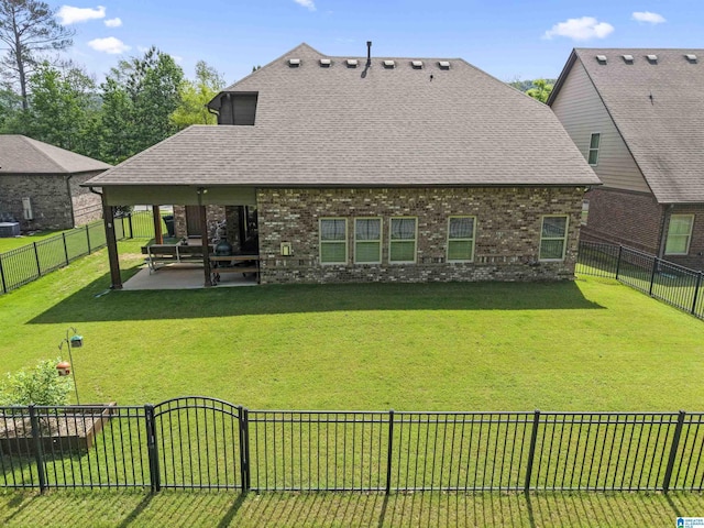 1104 Norman Way, Birmingham, AL 35242 - rear view of property featuring a patio, a fenced backyard, a yard, and brick siding