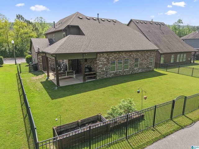 1104 Norman Way, Birmingham, AL 35242 - rear view of house with a fenced backyard, brick siding, a shingled roof, a patio area, and a yard