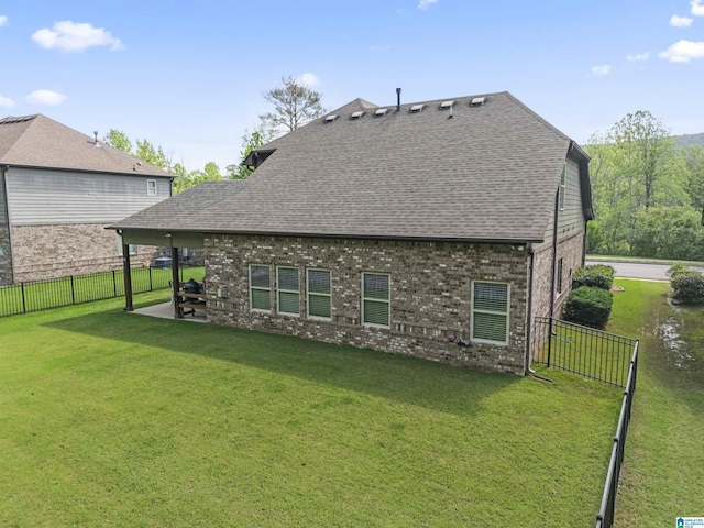 1104 Norman Way, Birmingham, AL 35242 - back of property with a lawn, brick siding, a shingled roof, and a fenced backyard